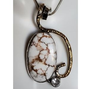 Genuine Wild Horse with White Topaz accent.